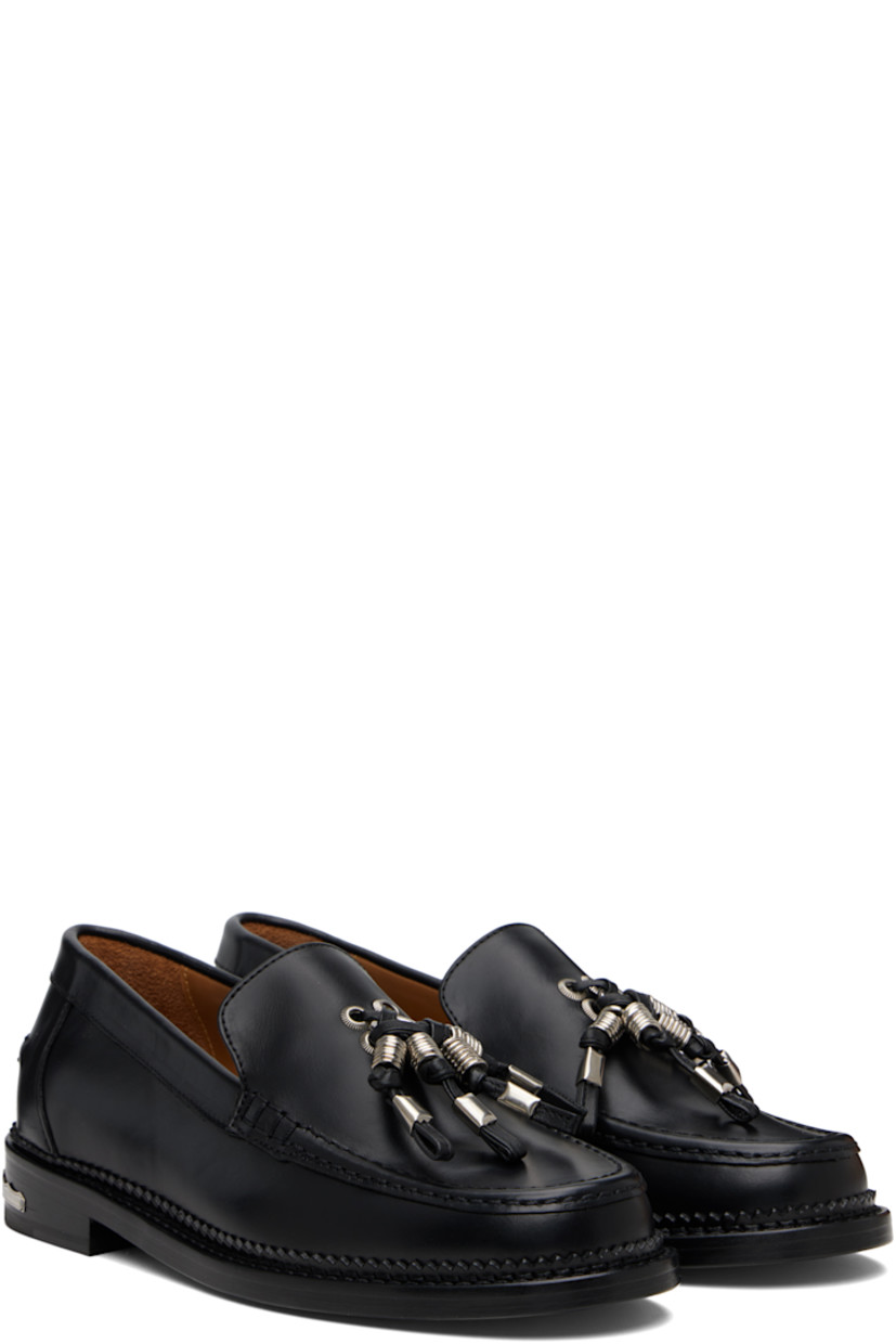 Buffed leather loafers.

· Moc toe
· Knotted strap with O-rings at vamp
· Pinched seam at heel counter
· Serrated edge at welt
· Engraved plaque at heel
· Stacked leather heel with rubber injection
· Leather sole

Supplier color: Black