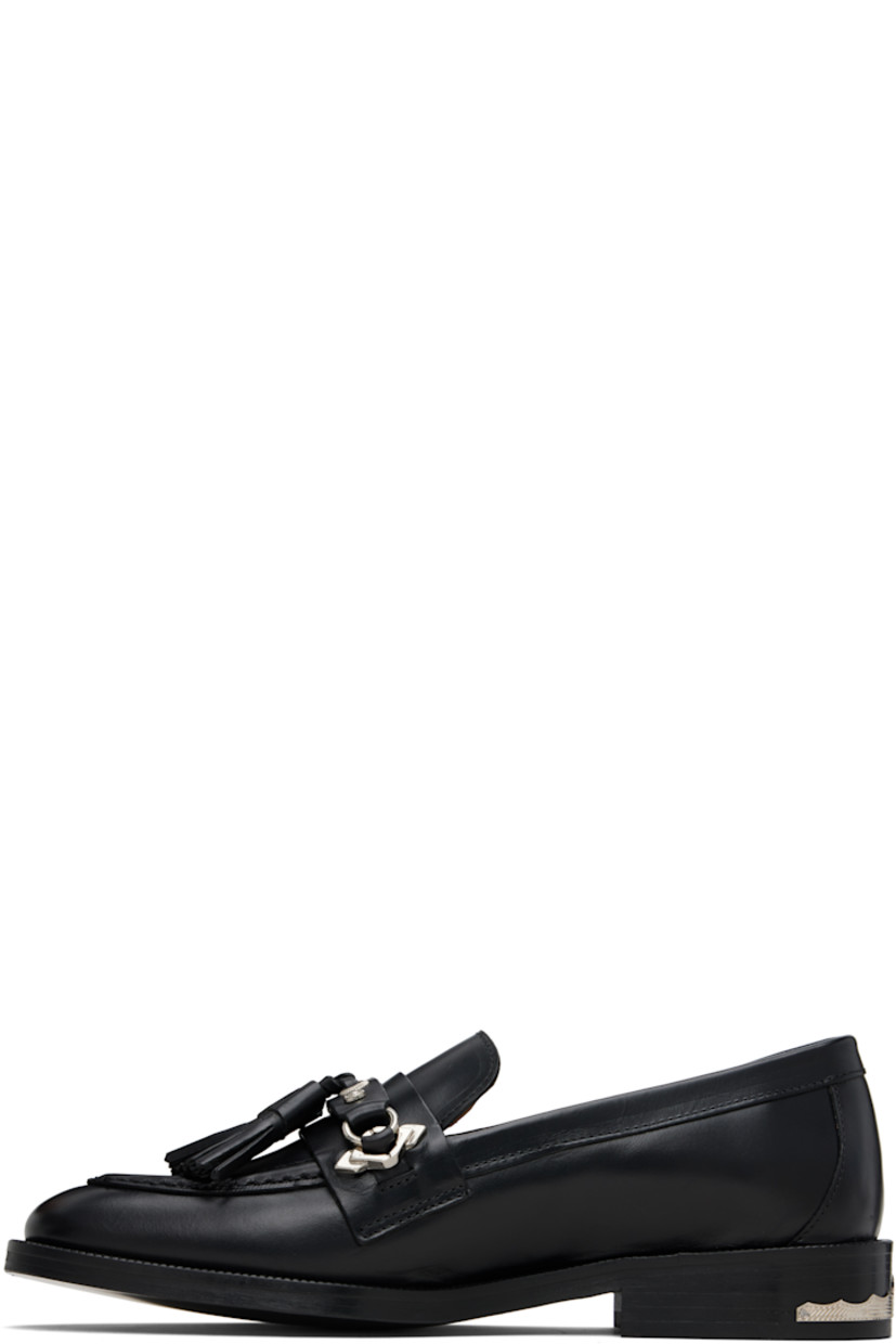 Buffed leather loafers.

· Moc toe
· Strap with tassels at vamp
· Serrated detailing at welt
· Engraved plaque at heel
· Stacked leather heel with rubber injection
· Leather sole

Supplier color: Black