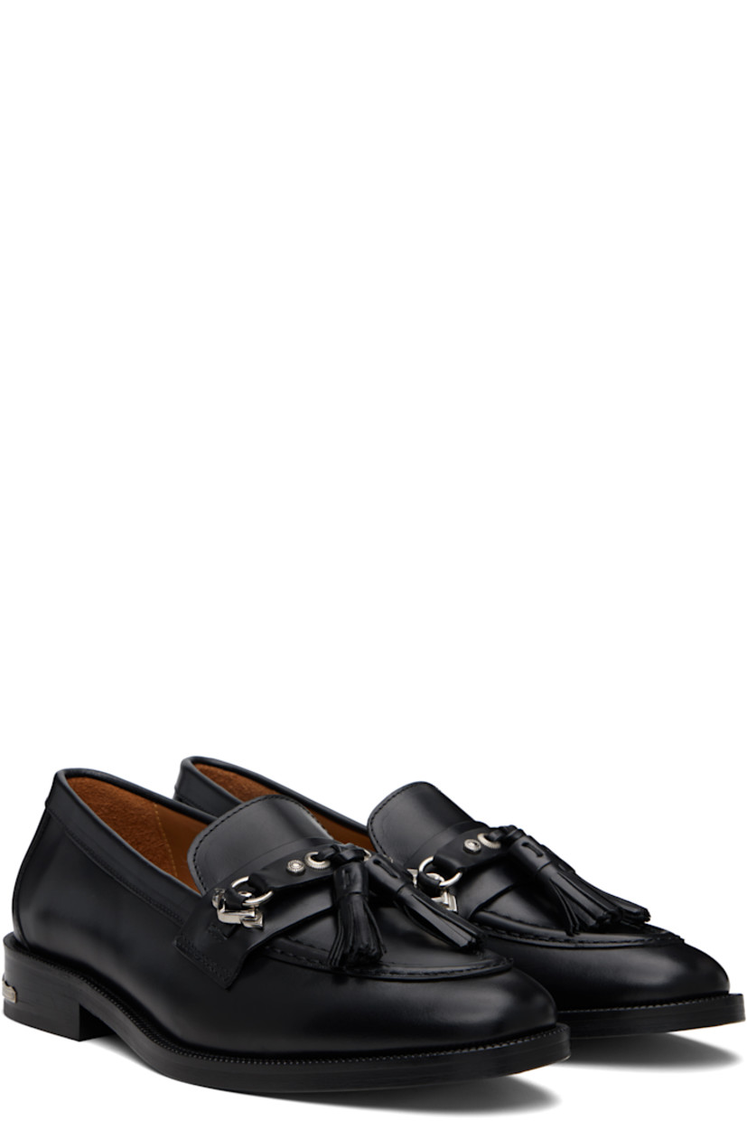 Buffed leather loafers.

· Moc toe
· Strap with tassels at vamp
· Serrated detailing at welt
· Engraved plaque at heel
· Stacked leather heel with rubber injection
· Leather sole

Supplier color: Black
