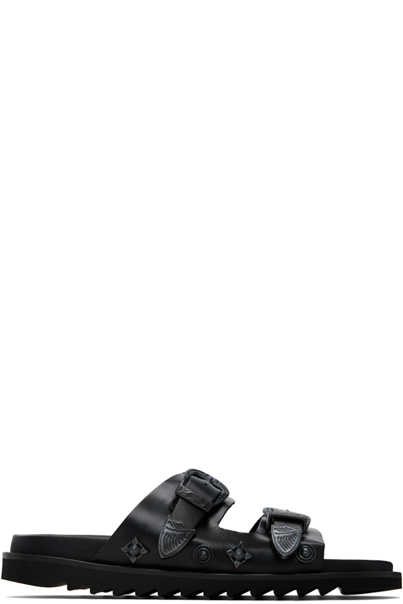Buffed leather sandals.

· Graphic hardware throughout
· Open toe
· Pin-buckle straps at vamp
· Logo stamp at molded footbed
· Foam rubber midsole
· Treaded rubber sole

Available exclusively at SSENSE.

Supplier color: Black tonal