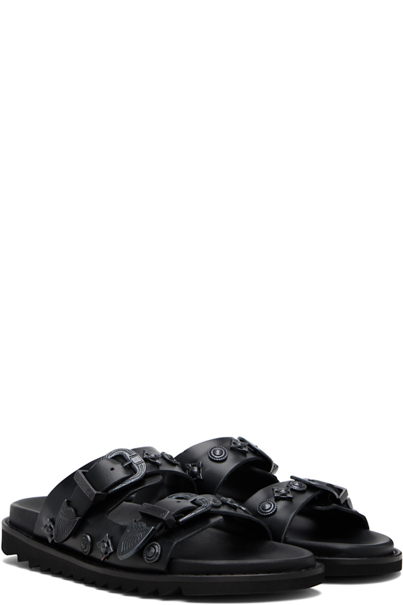 Buffed leather sandals.

· Graphic hardware throughout
· Open toe
· Pin-buckle straps at vamp
· Logo stamp at molded footbed
· Foam rubber midsole
· Treaded rubber sole

Available exclusively at SSENSE.

Supplier color: Black tonal