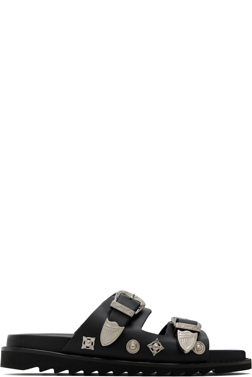 Buffed leather sandals.

· Graphic hardware throughout
· Open toe
· Pin-buckle straps at vamp
· Logo stamp at molded footbed
· Foam rubber midsole
· Treaded rubber sole

Supplier color: Black