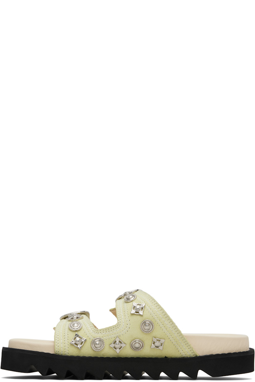Suede sandals.

· Graphic hardware throughout
· Open toe
· Pin-buckle straps at vamp
· Logo stamp at molded footbed
· Buffed leather lining
· Foam rubber midsole
· Treaded rubber sole
· Contrast stitching in white

Supplier color: Beige