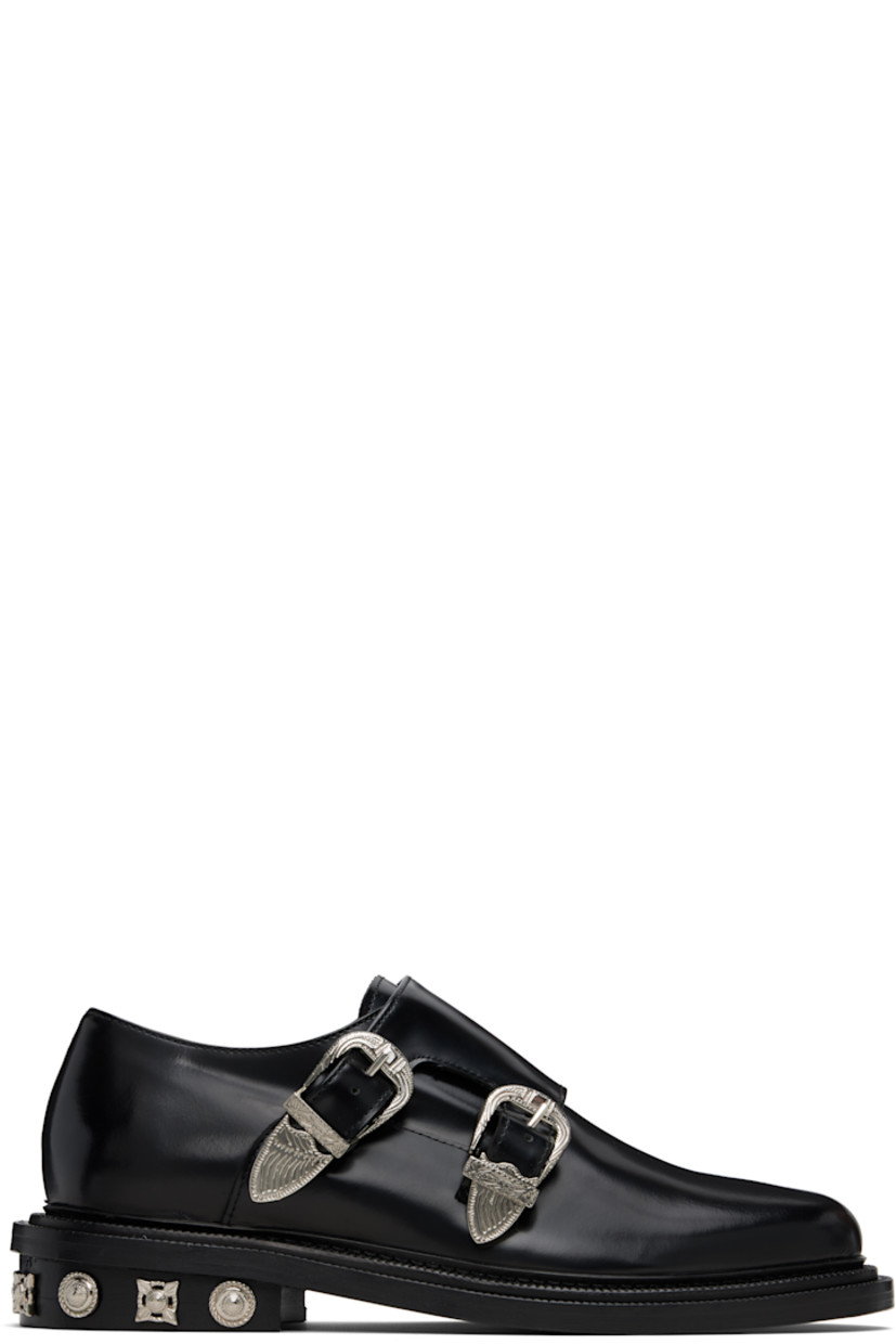 Polished leather monkstraps.

· Strap with pin-buckle fastenings at vamp
· Buffed leather lining
· Serrated detailing at welt
· Graphic hardware at heel
· Stacked leather heel with rubber injection
· Leather sole

Supplier color: Black