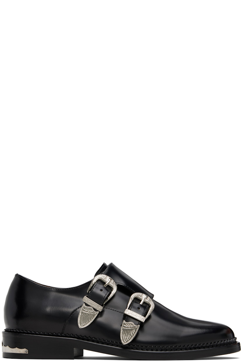 Polished leather monkstraps.

· Strap with pin-buckle fastenings at vamp
· Buffed leather lining
· Serrated detailing at welt
· Engraved plaque at heel
· Stacked leather heel with rubber injection
· Leather sole

Supplier color: Black