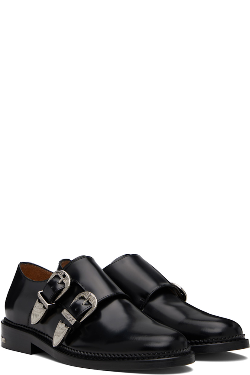Polished leather monkstraps.

· Strap with pin-buckle fastenings at vamp
· Buffed leather lining
· Serrated detailing at welt
· Engraved plaque at heel
· Stacked leather heel with rubber injection
· Leather sole

Supplier color: Black