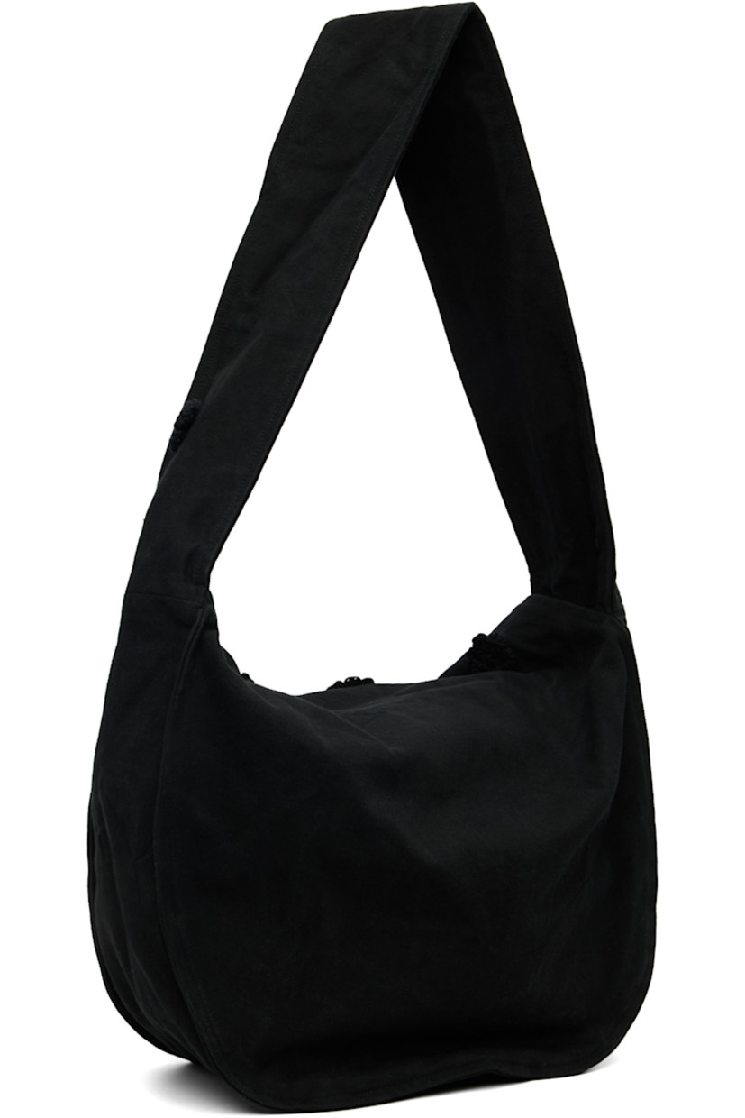 Cotton drill messenger bag.

· Crocheted floral appliqués throughout
· Fixed crossbody strap
· Foldover flap
· Patch pocket at interior
· H14" x W17" x D7.5"

Supplier color: Black