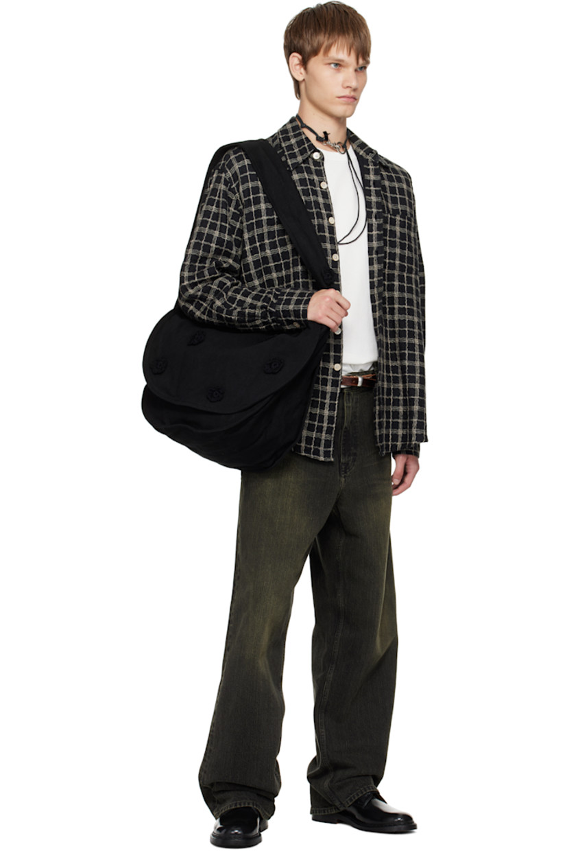 Cotton drill messenger bag.

· Crocheted floral appliqués throughout
· Fixed crossbody strap
· Foldover flap
· Patch pocket at interior
· H14" x W17" x D7.5"

Supplier color: Black