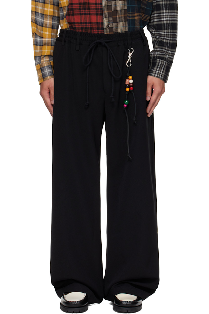 Wide-leg gabardine trousers.

· Drawstring and belt loops at elasticized waistband
· Detachable beaded leather keychain at front belt loop
· Four-pocket styling
· Button fly
· Leather logo patch at back waistband

Supplier color: Black