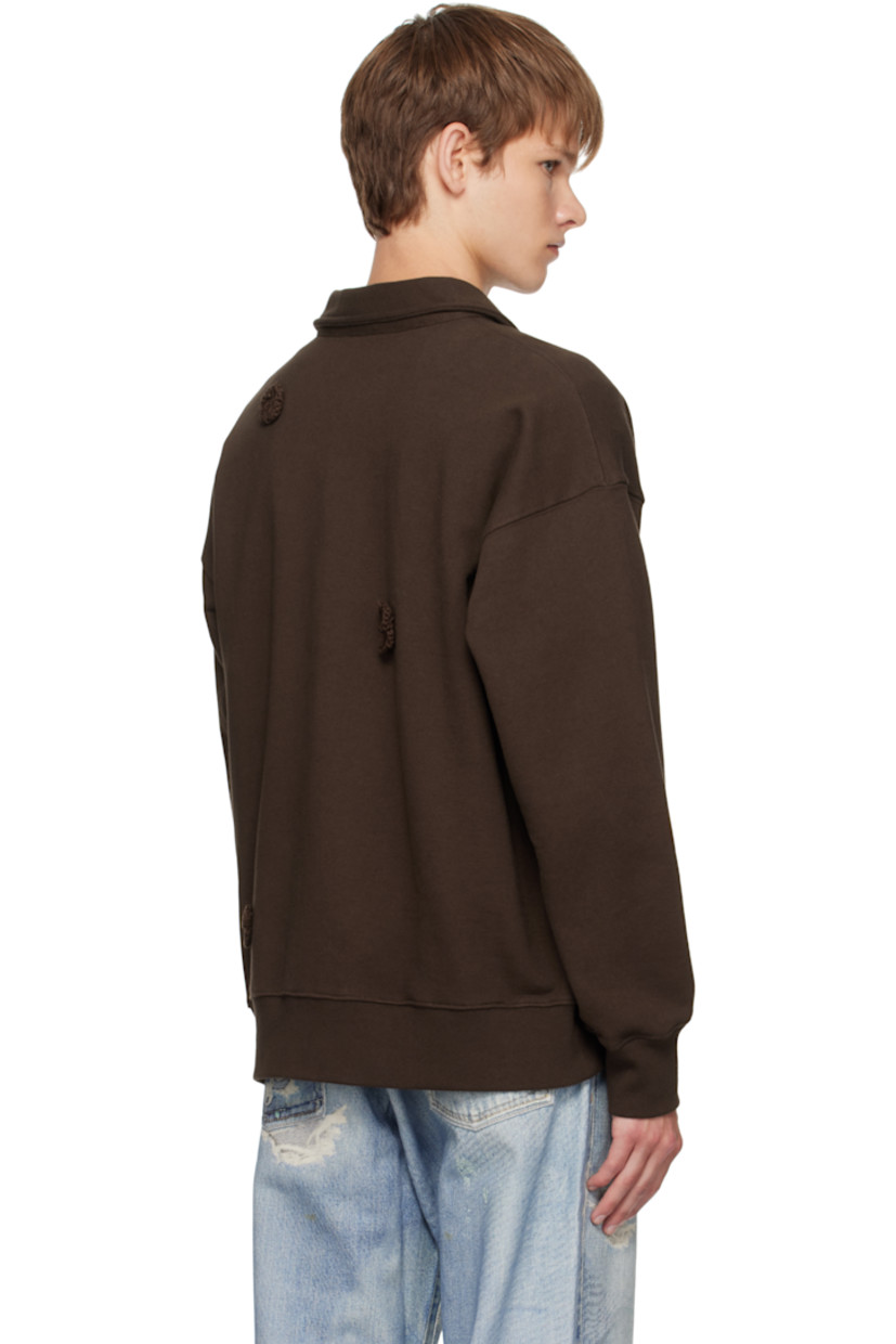French terry sweatshirt.

· Floral appliqués throughout
· Spread collar
· Half-zip closure
· Rib-knit hem and cuffs
· Dropped shoulders

Supplier color: Brown