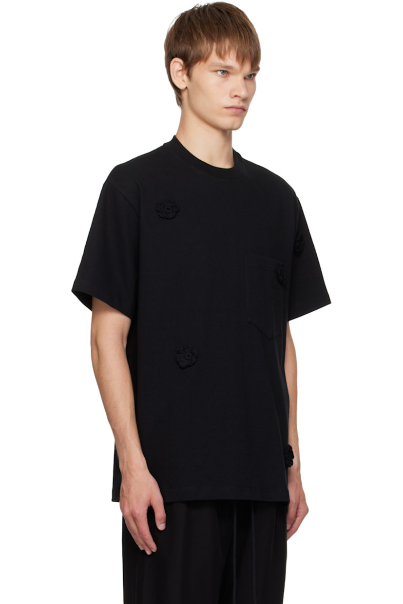 Cotton jersey T-shirt. 

· Crocheted floral appliqués throughout 
· Rib-knit crewneck
· Patch pocket at chest

Supplier color: Black