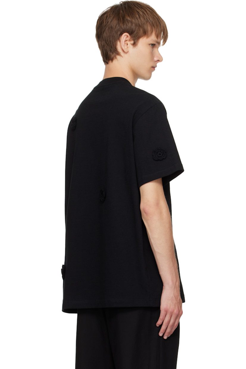 Cotton jersey T-shirt. 

· Crocheted floral appliqués throughout 
· Rib-knit crewneck
· Patch pocket at chest

Supplier color: Black