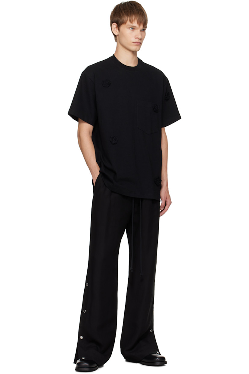 Cotton jersey T-shirt. 

· Crocheted floral appliqués throughout 
· Rib-knit crewneck
· Patch pocket at chest

Supplier color: Black