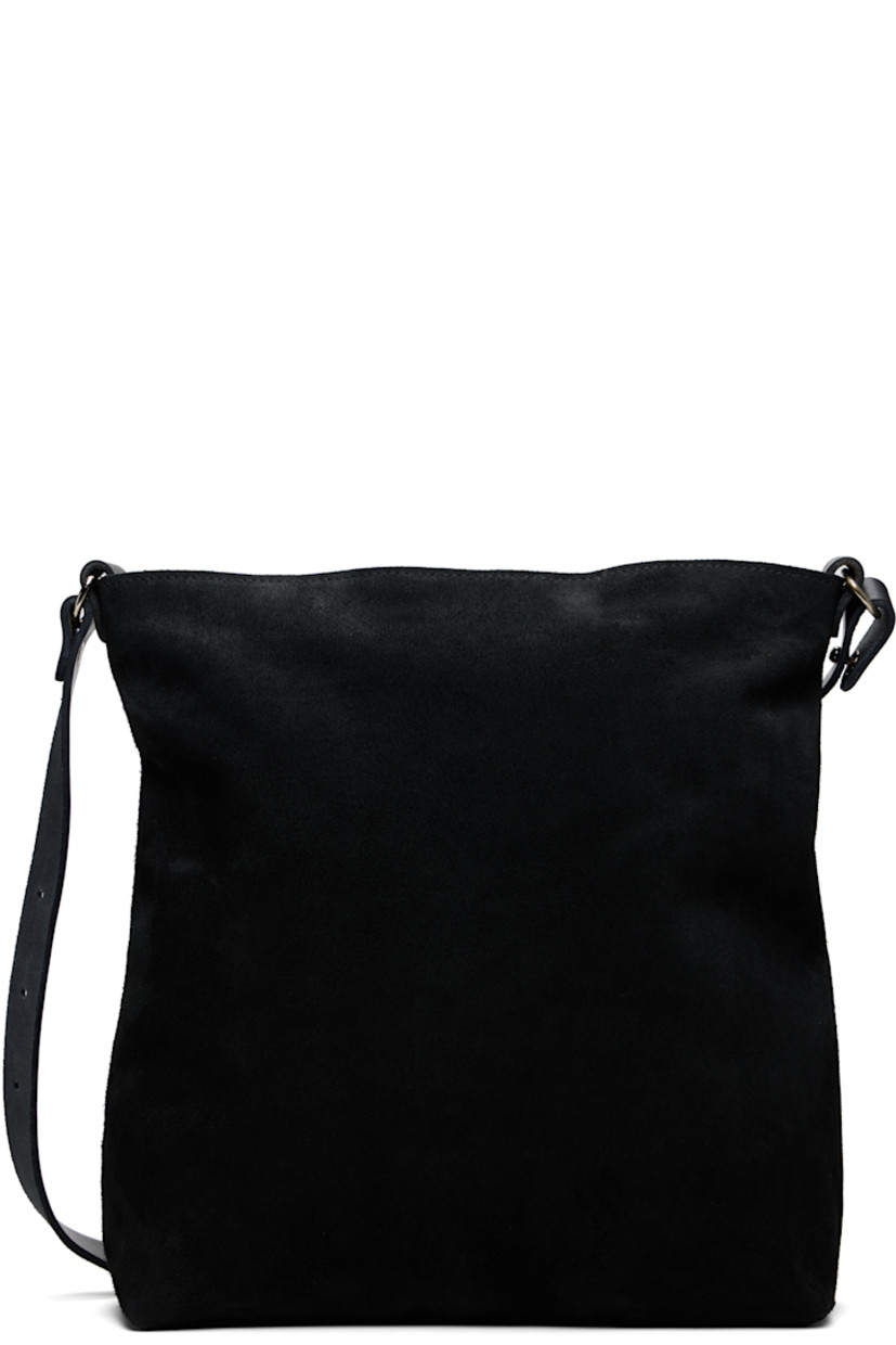 Horse suede shoulder bag.

· Adjustable shoulder strap
· Zip closure
· Patch pockets at interior
· Nylon twill lining
· H14" x W13" x D5"

Supplier color: BLKT