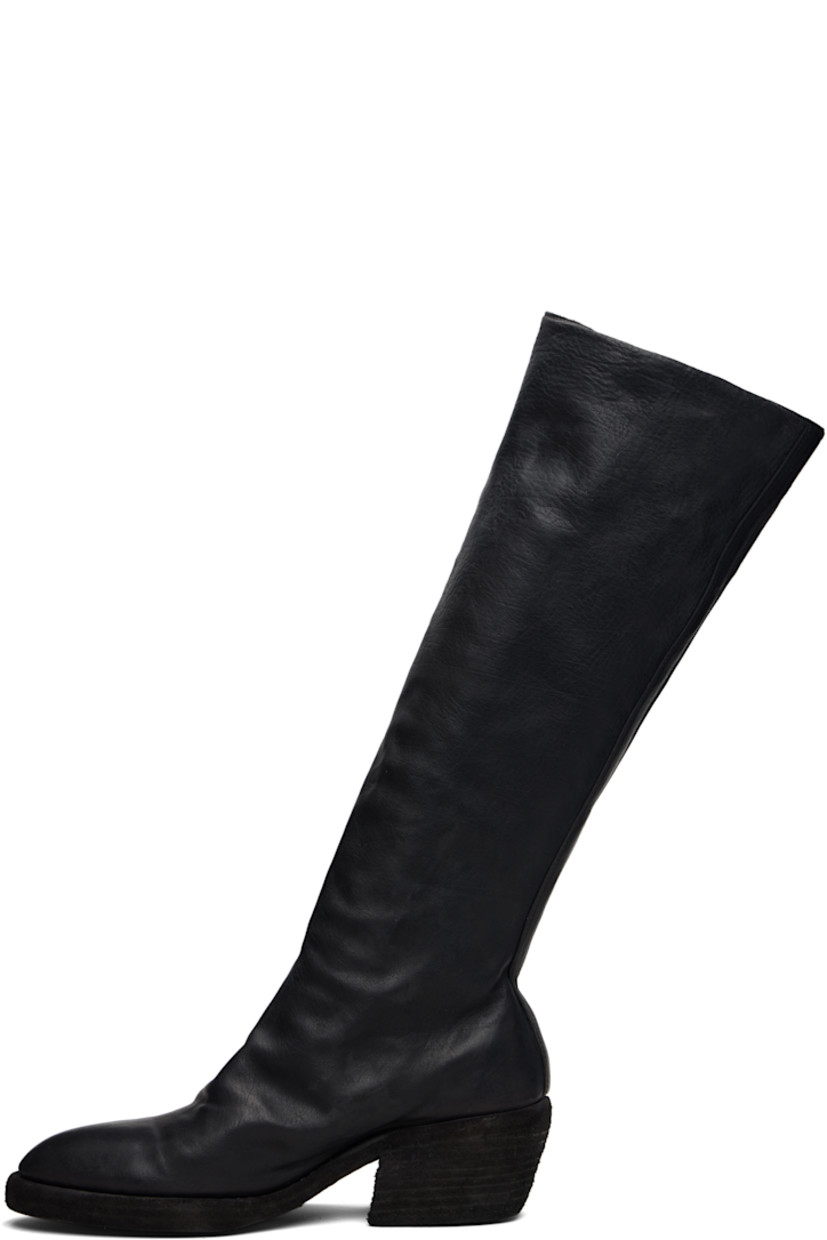 Knee-high grained horse leather boots. 

· Zip closure at vamp
· Contrast stitching in white at welt 
· Rubber midsole 
· Rubber block heel 
· Leather sole 
· Heel: H2"

Supplier color: Blkt