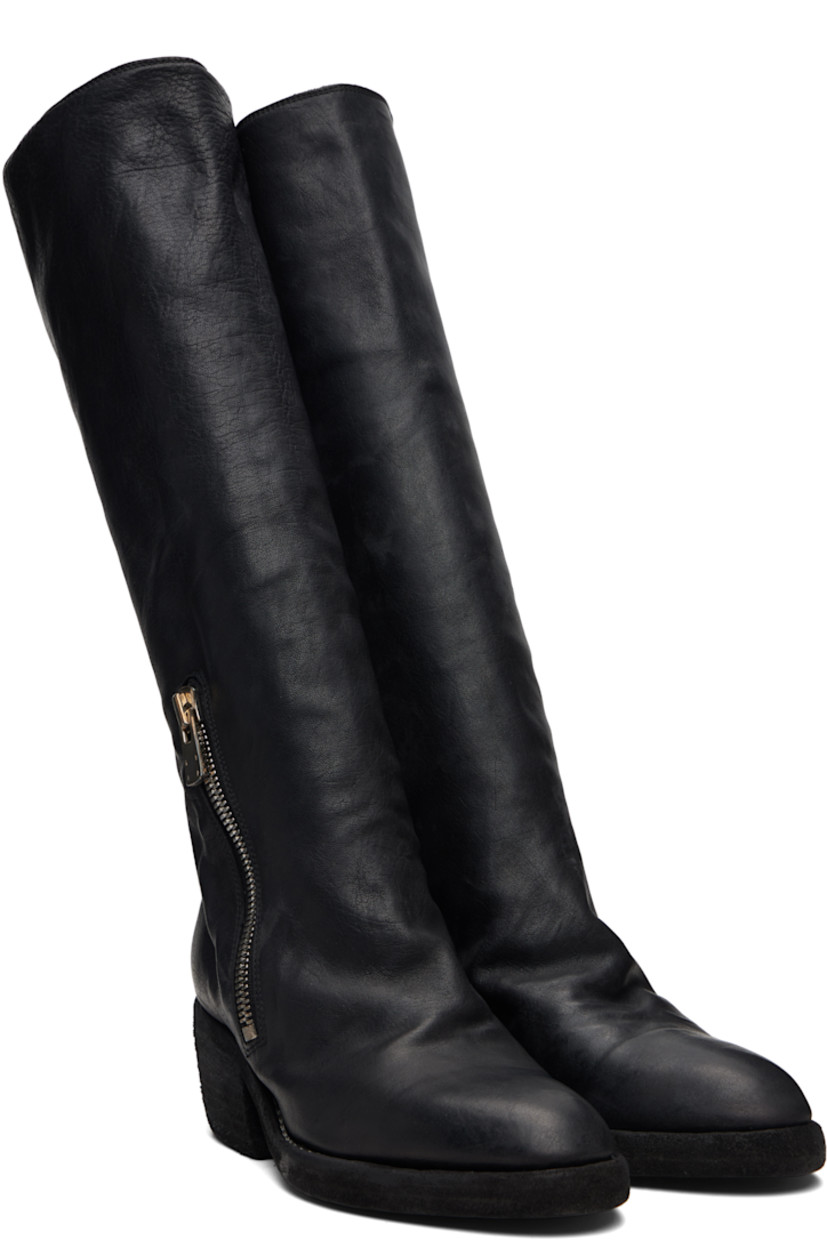 Knee-high grained horse leather boots. 

· Zip closure at vamp
· Contrast stitching in white at welt 
· Rubber midsole 
· Rubber block heel 
· Leather sole 
· Heel: H2"

Supplier color: Blkt
