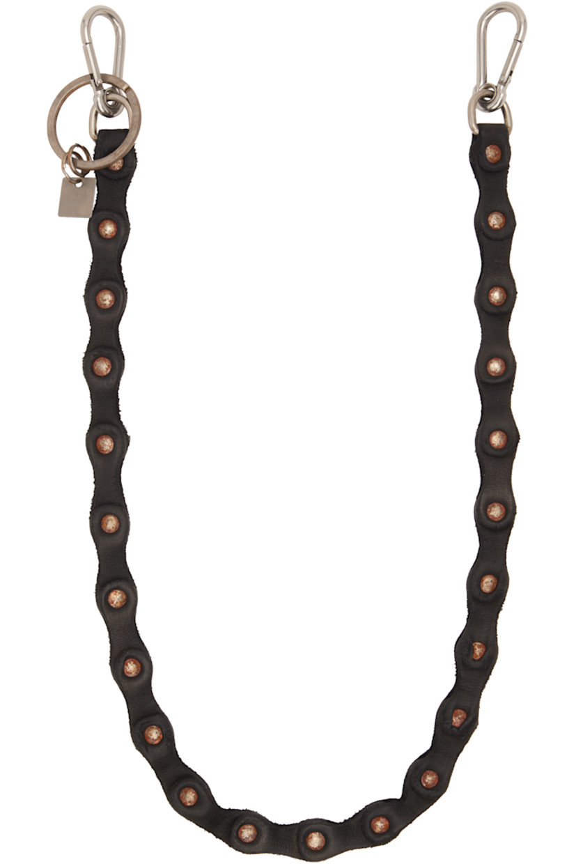Blistered horse leather keychain. 

· Oxidized rivets at length 
· Logo charm and keyring at end
· Lanyard clasp at ends
· L28"

Supplier color: Black