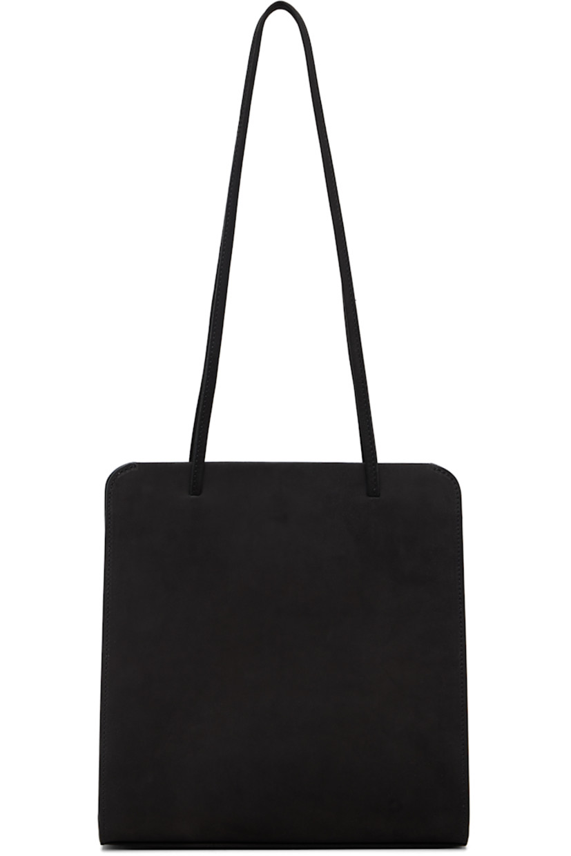Nubuck shoulder bag.

· Twin shoulder straps
· Patch pocket at back face
· Accordion panel at sides
· Magnetic closure
· Patch pocket at interior
· Twill lining
· H9.75" x W9.25" x D2.75"

Supplier color: Noir nubuck
