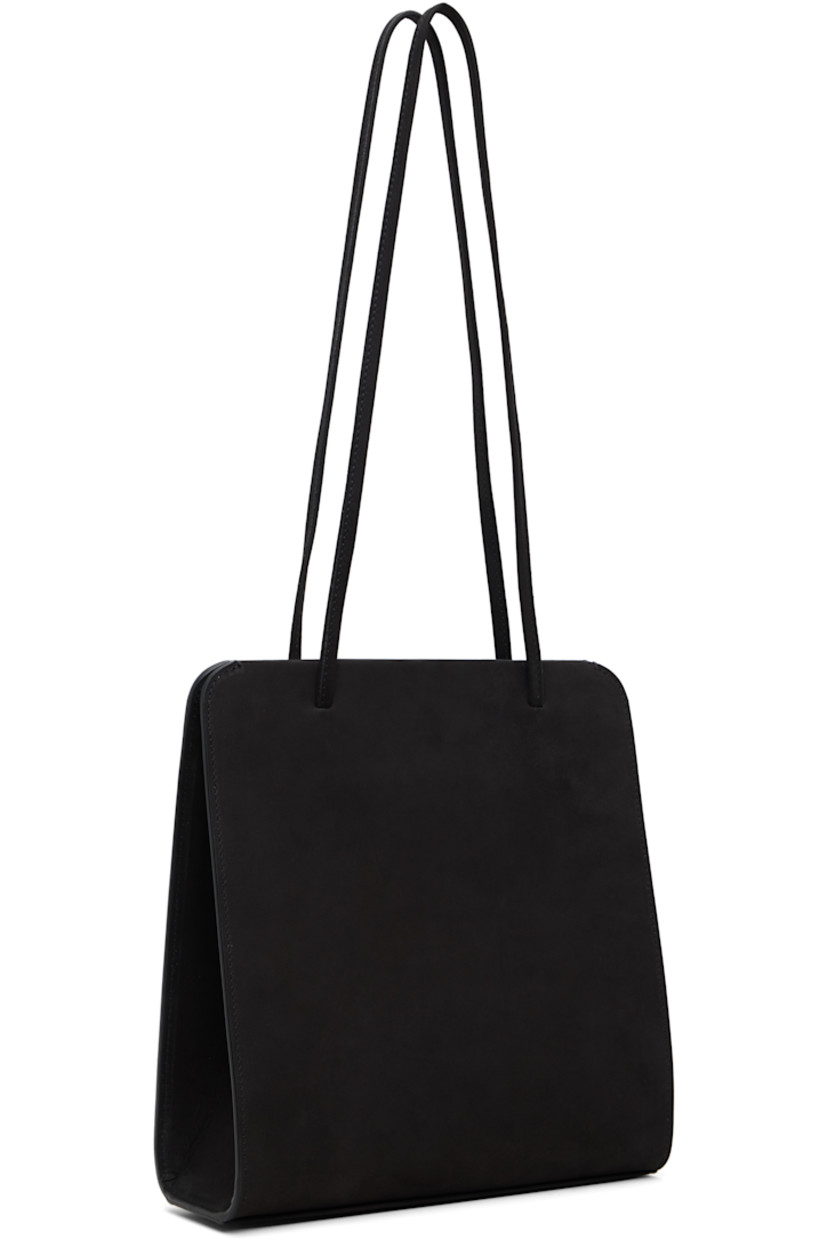 Nubuck shoulder bag.

· Twin shoulder straps
· Patch pocket at back face
· Accordion panel at sides
· Magnetic closure
· Patch pocket at interior
· Twill lining
· H9.75" x W9.25" x D2.75"

Supplier color: Noir nubuck