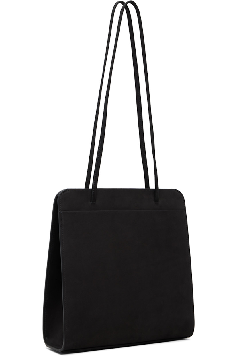 Nubuck shoulder bag.

· Twin shoulder straps
· Patch pocket at back face
· Accordion panel at sides
· Magnetic closure
· Patch pocket at interior
· Twill lining
· H9.75" x W9.25" x D2.75"

Supplier color: Noir nubuck