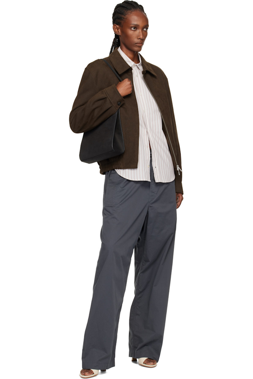Nubuck shoulder bag.

· Twin shoulder straps
· Patch pocket at back face
· Accordion panel at sides
· Magnetic closure
· Patch pocket at interior
· Twill lining
· H9.75" x W9.25" x D2.75"

Supplier color: Noir nubuck