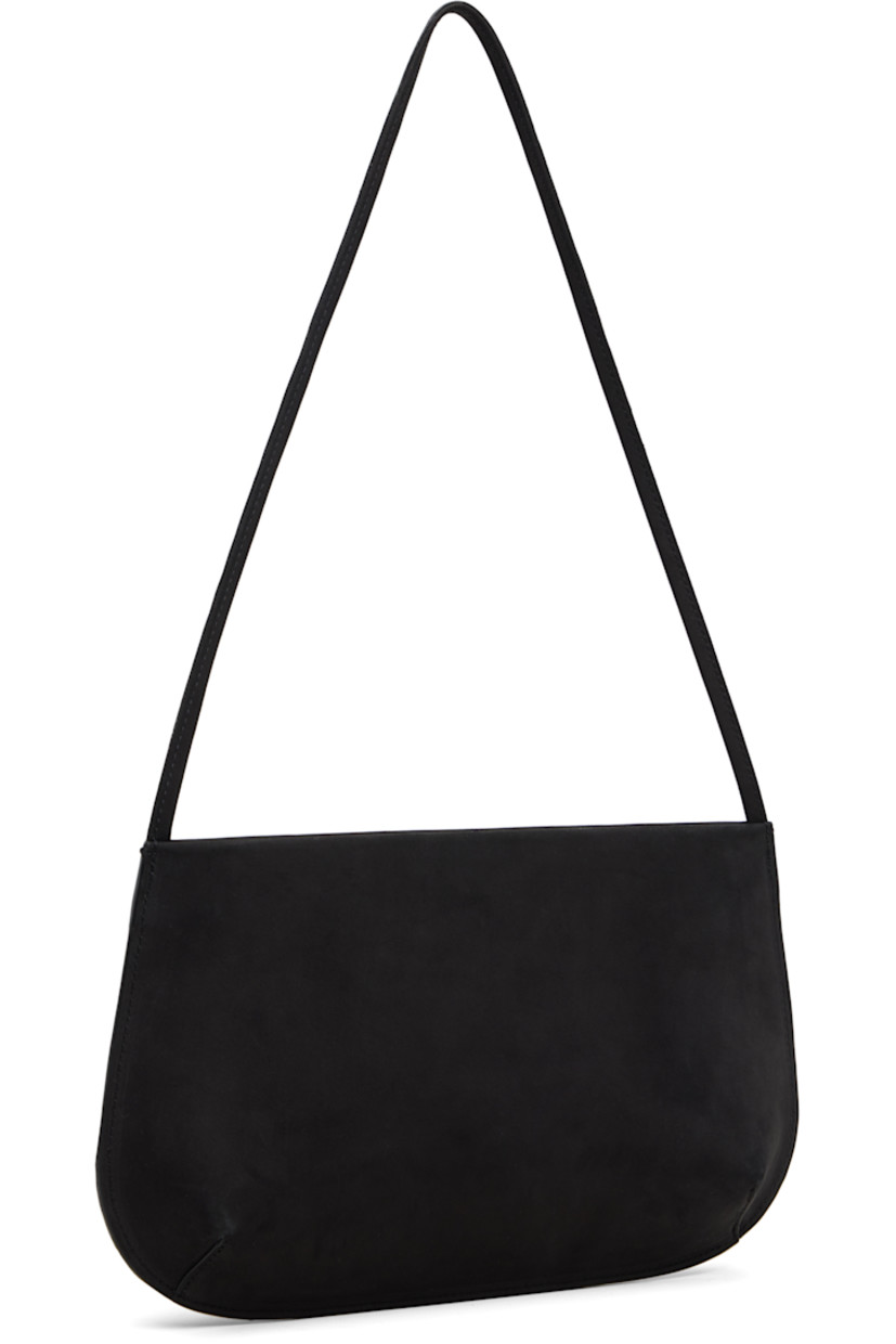 Nubuck shoulder bag.

· Fixed shoulder strap
· Darts at base
· Magnetic closure
· Patch pocket at interior
· Twill lining
· H6" x W11" x D2.25"

Supplier color: Noir nubuck