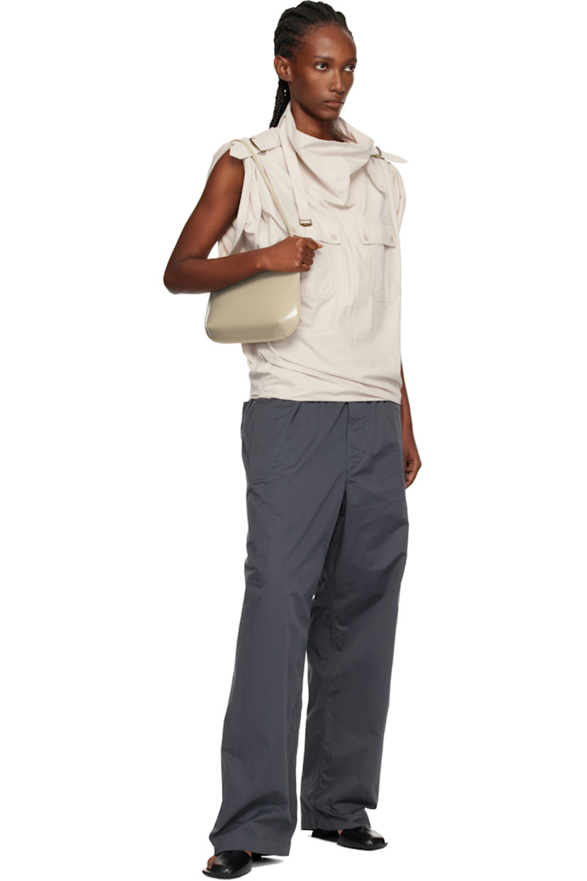 Spazzolato calfskin shoulder bag.

· Fixed shoulder strap
· Darts at base
· Magnetic closure
· Patch pocket at interior
· Twill lining
· H6" x W11" x D2.25"

Supplier color: Latte spazzolato