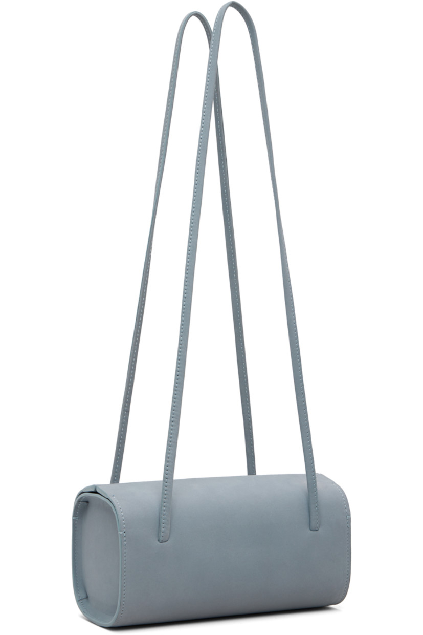 Nubuck shoulder bag.

· Twin shoulder straps
· Magnetic closure
· Twill lining
· H3.75" x W7.75" x D3.5"

Available exclusively at SSENSE.

Supplier color: Blue grey nubuck