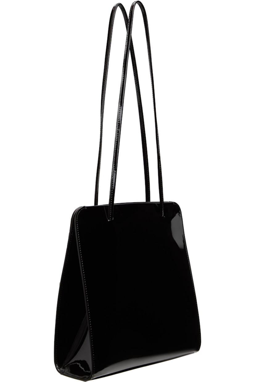 Patent calfskin shoulder bag.

· Twin shoulder straps
· Patch pocket at back face
· Accordion panel at sides
· Magnetic closure
· Patch pocket at interior
· Twill lining
· H9.75" x W9.25" x D2.75"

Available exclusively at SSENSE.

Supplier color: Noir
