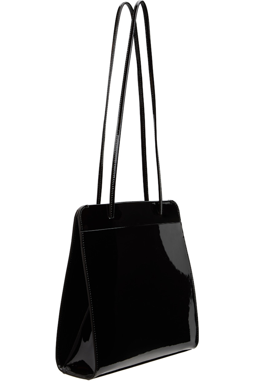 Patent calfskin shoulder bag.

· Twin shoulder straps
· Patch pocket at back face
· Accordion panel at sides
· Magnetic closure
· Patch pocket at interior
· Twill lining
· H9.75" x W9.25" x D2.75"

Available exclusively at SSENSE.

Supplier color: Noir