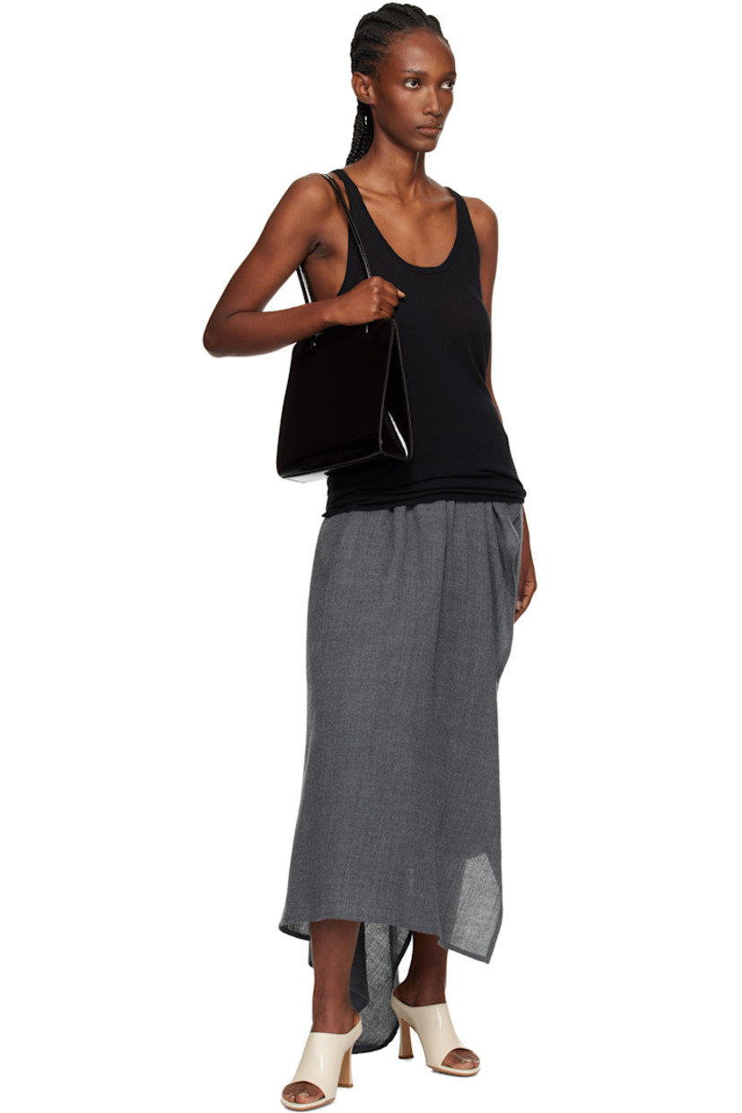 Patent calfskin shoulder bag.

· Twin shoulder straps
· Patch pocket at back face
· Accordion panel at sides
· Magnetic closure
· Patch pocket at interior
· Twill lining
· H9.75" x W9.25" x D2.75"

Available exclusively at SSENSE.

Supplier color: Noir