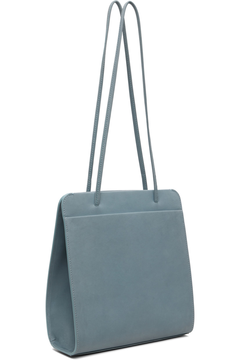 Nubuck shoulder bag.

· Twin shoulder straps
· Patch pocket at back face
· Accordion panel at sides
· Magnetic closure
· Patch pocket at interior
· Twill lining
· H9.75" x W9.25" x D2.75"

Available exclusively at SSENSE.

Supplier color: Blue grey nubuck