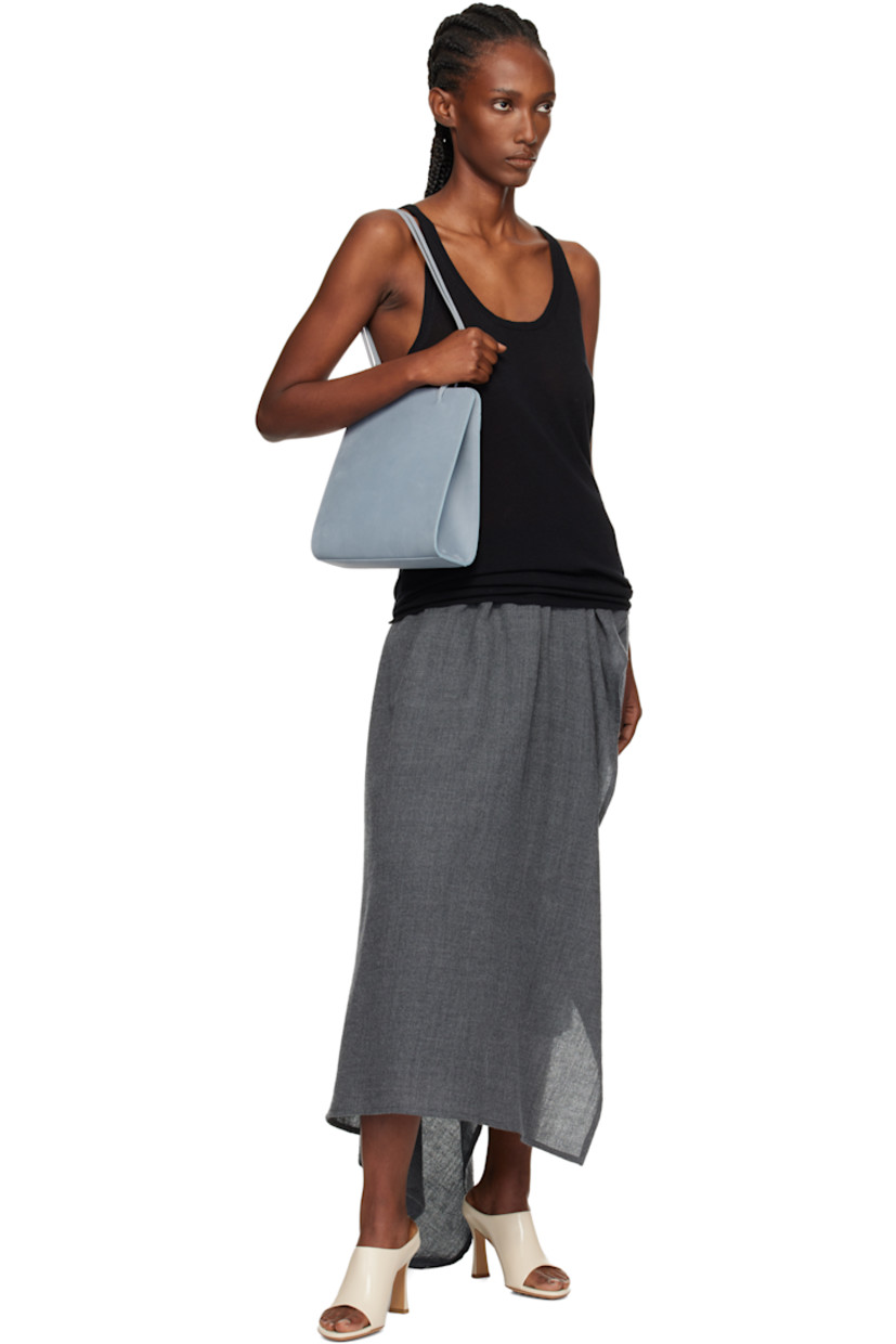 Nubuck shoulder bag.

· Twin shoulder straps
· Patch pocket at back face
· Accordion panel at sides
· Magnetic closure
· Patch pocket at interior
· Twill lining
· H9.75" x W9.25" x D2.75"

Available exclusively at SSENSE.

Supplier color: Blue grey nubuck