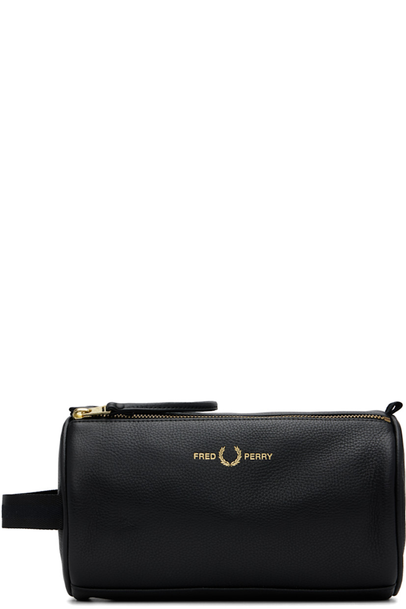 Grained leather toiletry bag.

· Detachable leather strap
· Logo stamp at face
· Pull-loop and webbing strap at sides
· Zip closure with press-stud tab
· Zip pocket at interior
· Logo-printed plain-woven lining
· Logo-engraved gold-tone hardware
· H6.25" x W9" x D5.25"

Supplier color: Black