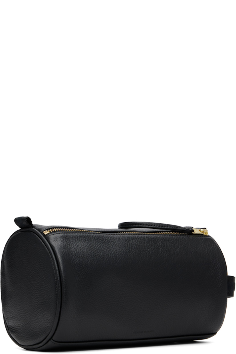Grained leather toiletry bag.

· Detachable leather strap
· Logo stamp at face
· Pull-loop and webbing strap at sides
· Zip closure with press-stud tab
· Zip pocket at interior
· Logo-printed plain-woven lining
· Logo-engraved gold-tone hardware
· H6.25" x W9" x D5.25"

Supplier color: Black