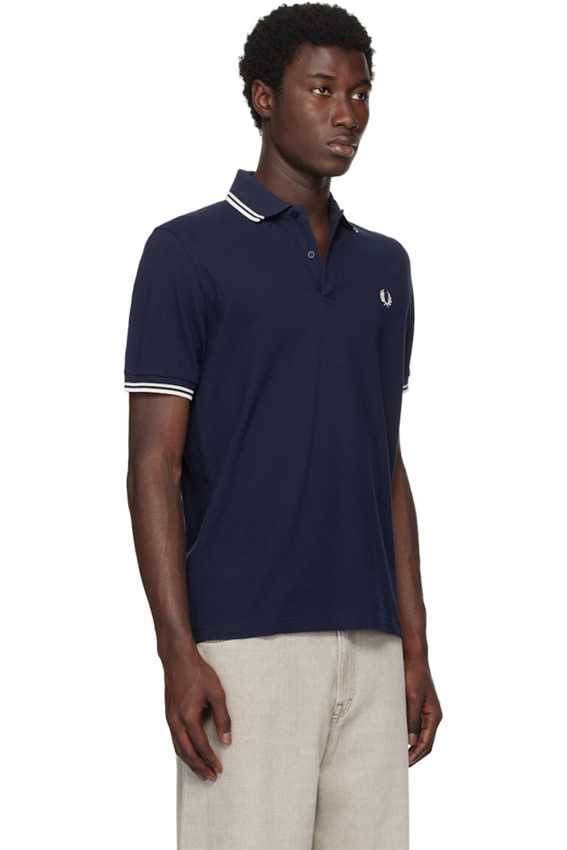 Cotton piqué polo.

· Striped rib-knit spread collar and cuffs
· Two-button placket 
· Logo embroidered at chest

Supplier color: Dark Carbon/Ecru/Ecru