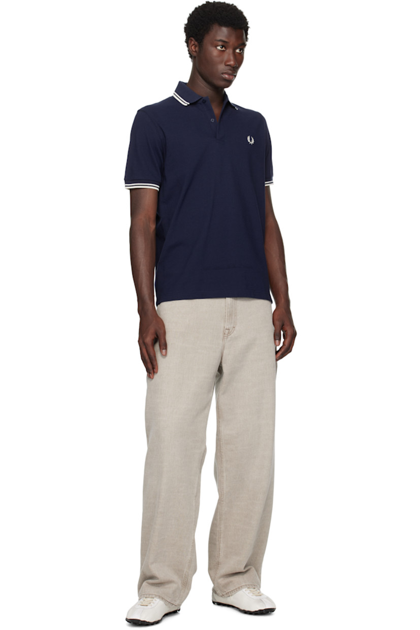 Cotton piqué polo.

· Striped rib-knit spread collar and cuffs
· Two-button placket 
· Logo embroidered at chest

Supplier color: Dark Carbon/Ecru/Ecru