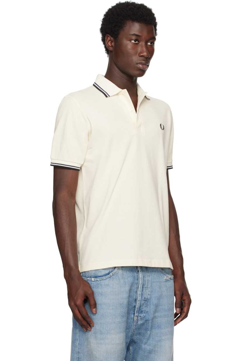 Cotton piqué polo.

· Striped rib-knit spread collar and cuffs
· Two-button placket 
· Logo embroidered at chest 
 
Supplier color: Ecru/Tennis Blue/Black