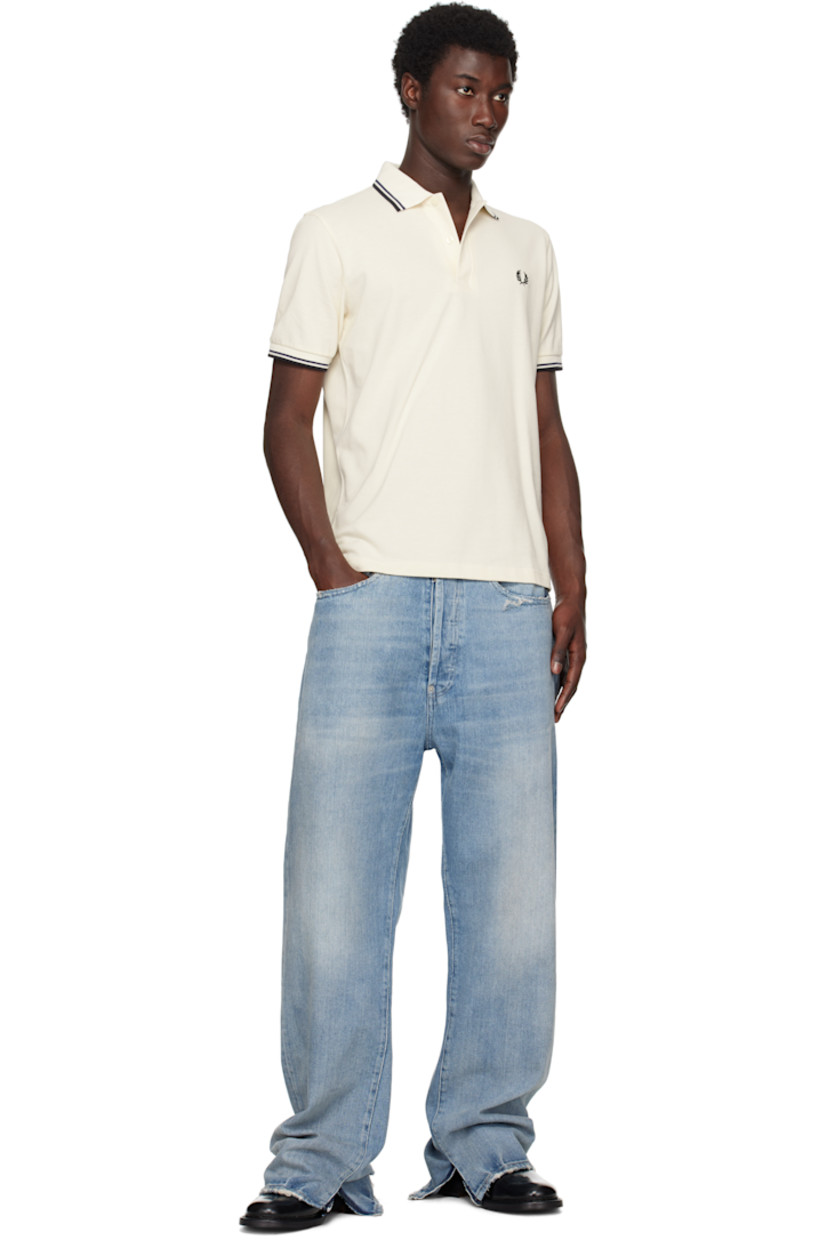 Cotton piqué polo.

· Striped rib-knit spread collar and cuffs
· Two-button placket 
· Logo embroidered at chest 
 
Supplier color: Ecru/Tennis Blue/Black
