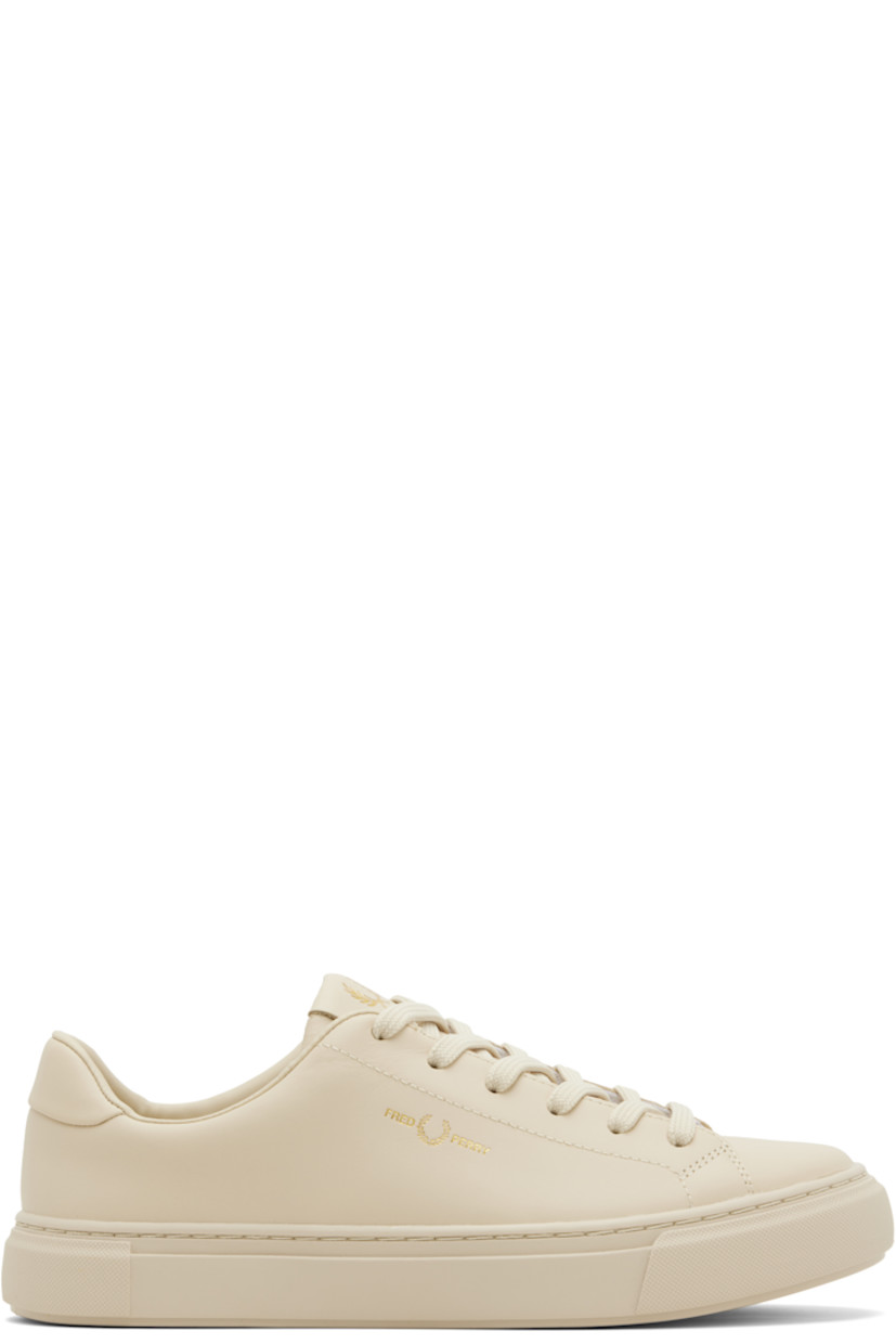 Low-top buffed leather sneakers.

· Lace-up closure
· Logo at padded tongue and outer side
· Padded collar
· Mesh lining
· Treaded rubber sole
· Contrast stitching in white

Supplier color: Oatmeal/Gold