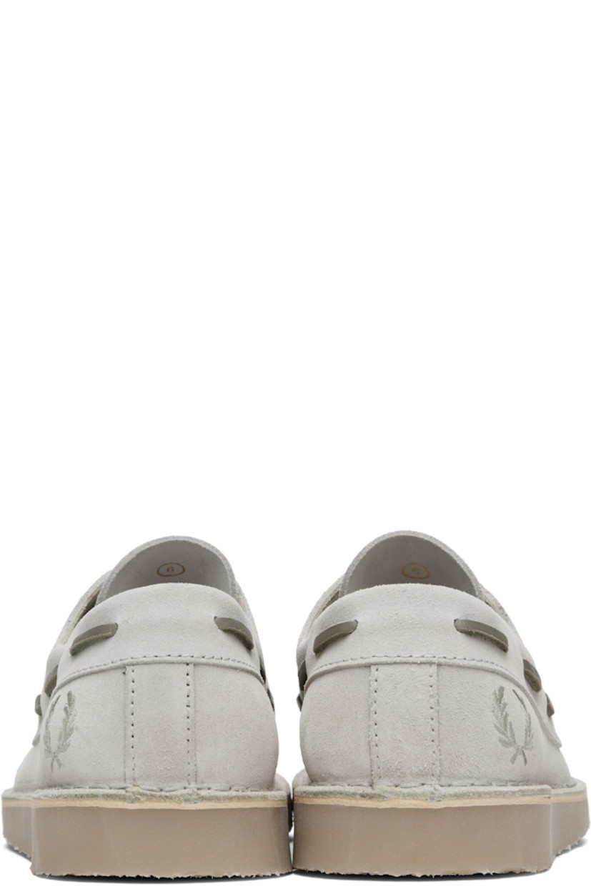 Suede boat shoes.

· Moc toe
· Lace-up closure
· Logo embroidered at outer side
· Topstitching at welt
· Crêpe-rubber sole

Supplier color: Light oyster