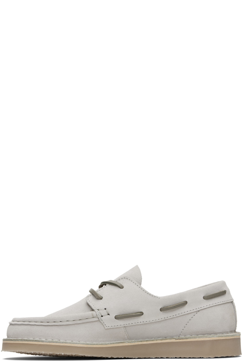 Suede boat shoes.

· Moc toe
· Lace-up closure
· Logo embroidered at outer side
· Topstitching at welt
· Crêpe-rubber sole

Supplier color: Light oyster