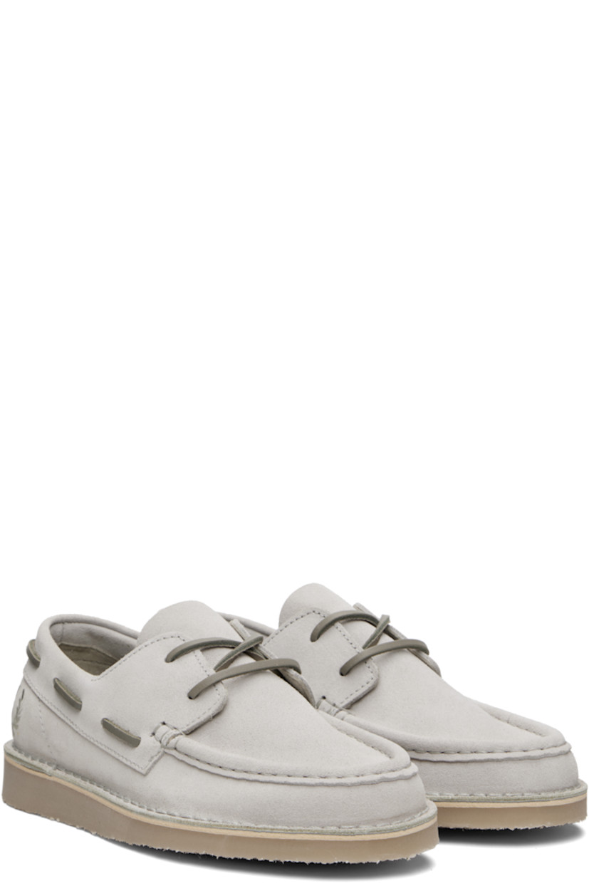 Suede boat shoes.

· Moc toe
· Lace-up closure
· Logo embroidered at outer side
· Topstitching at welt
· Crêpe-rubber sole

Supplier color: Light oyster