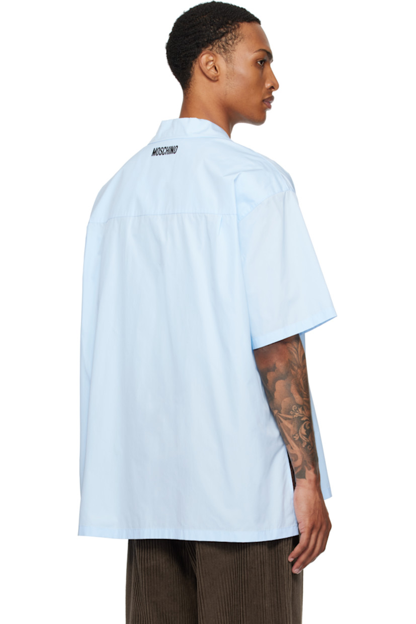Cotton poplin shirt.

· Spread collar
· Notched lapel
· Graphic stitched at chest
· Button closure
· Droptail hem
· Logo stitched at back collar

Supplier color: Azure
