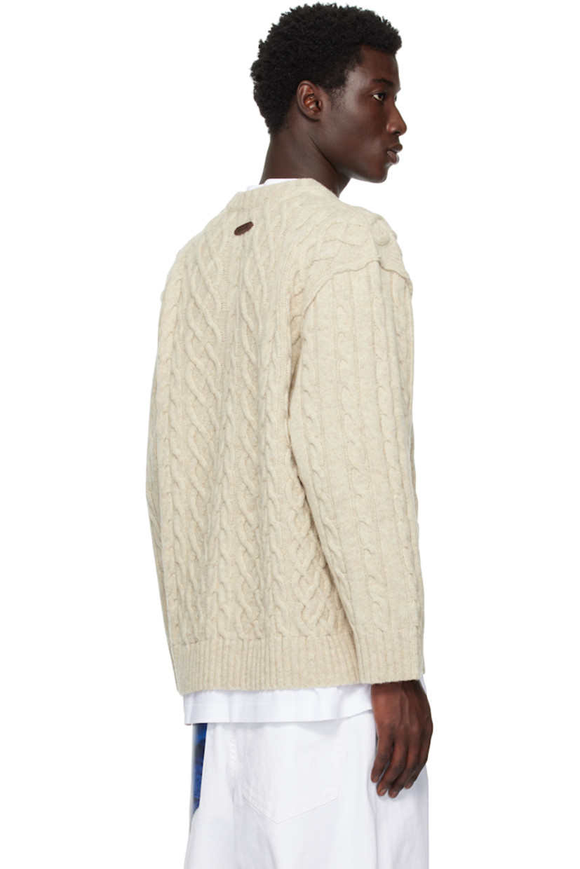 Cable-knit virgin wool sweater.

· Rib-knit crewneck, hem, and cuffs
· Dropped shoulders
· Full jersey lining
· Logo embroidered at back

Supplier color: Ivory