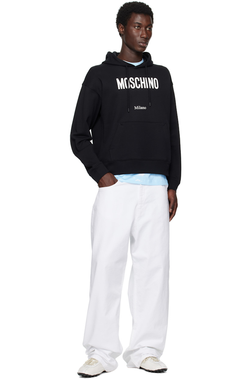 Organic cotton jersey hoodie.

· Drawstring at hood
· Logo and text printed at chest
· Kangaroo pocket
· Rib-knit cuffs and hem
· Dropped shoulders

Supplier color: Multi Black