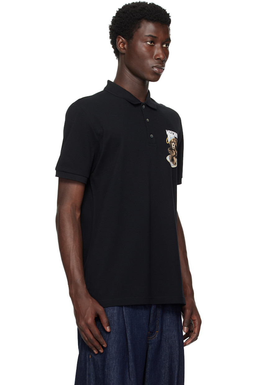 Cotton piqué polo.

· Rib-knit spread collar and cuffs
· Three-button placket
· Logo and graphic printed at chest
· Tennis-tail hem

Supplier color: Multi Black