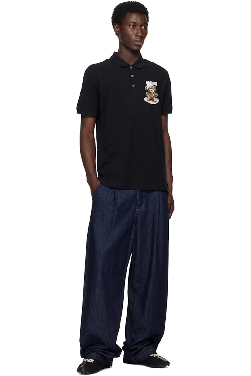 Cotton piqué polo.

· Rib-knit spread collar and cuffs
· Three-button placket
· Logo and graphic printed at chest
· Tennis-tail hem

Supplier color: Multi Black