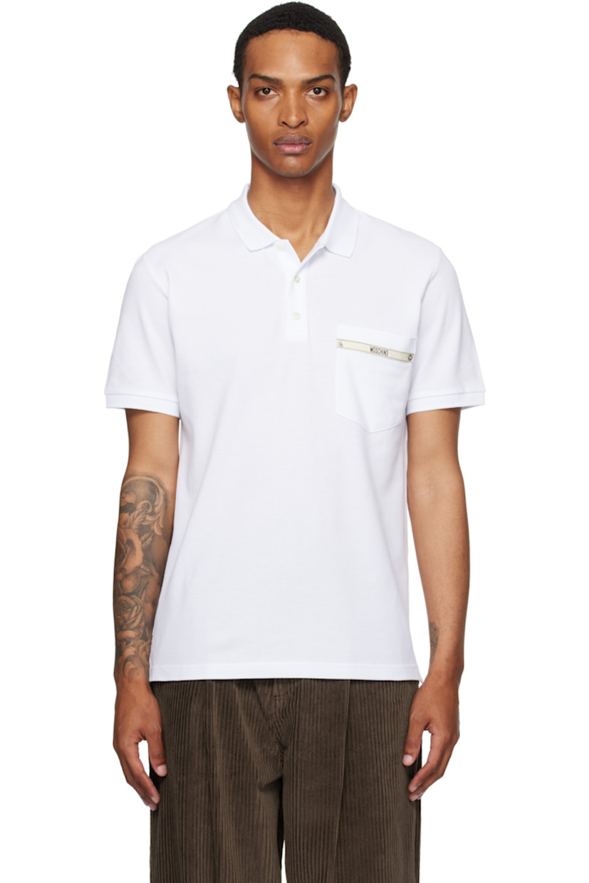 Cotton piqué polo.

· Rib-knit spread collar and cuffs
· Button closure
· Patch pocket and logo appliqué at chest
· Silver-tone hardware
· Tennis-tail hem

Supplier color: White