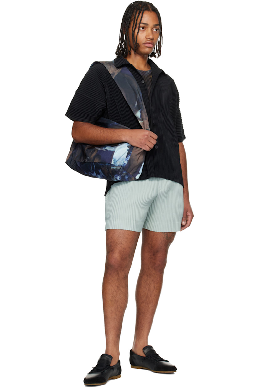 Satin messenger bag.

· Graphic pattern printed throughout 
· Integrated crossbody strap
· Zip pocket at face
· Two-way zip closure
· H11.5" x W15" x D5"

Supplier color: Brown